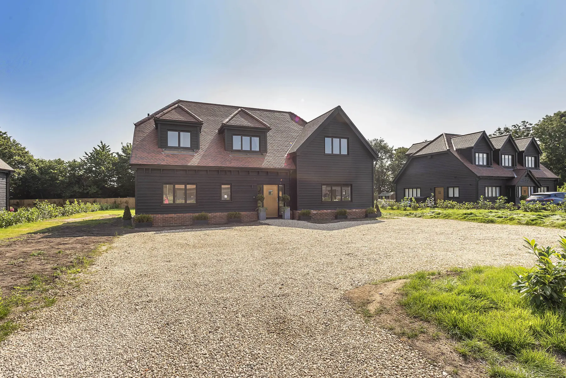 Completed new build houses with dark shiplap cladding - Chalfont St Giles HP8