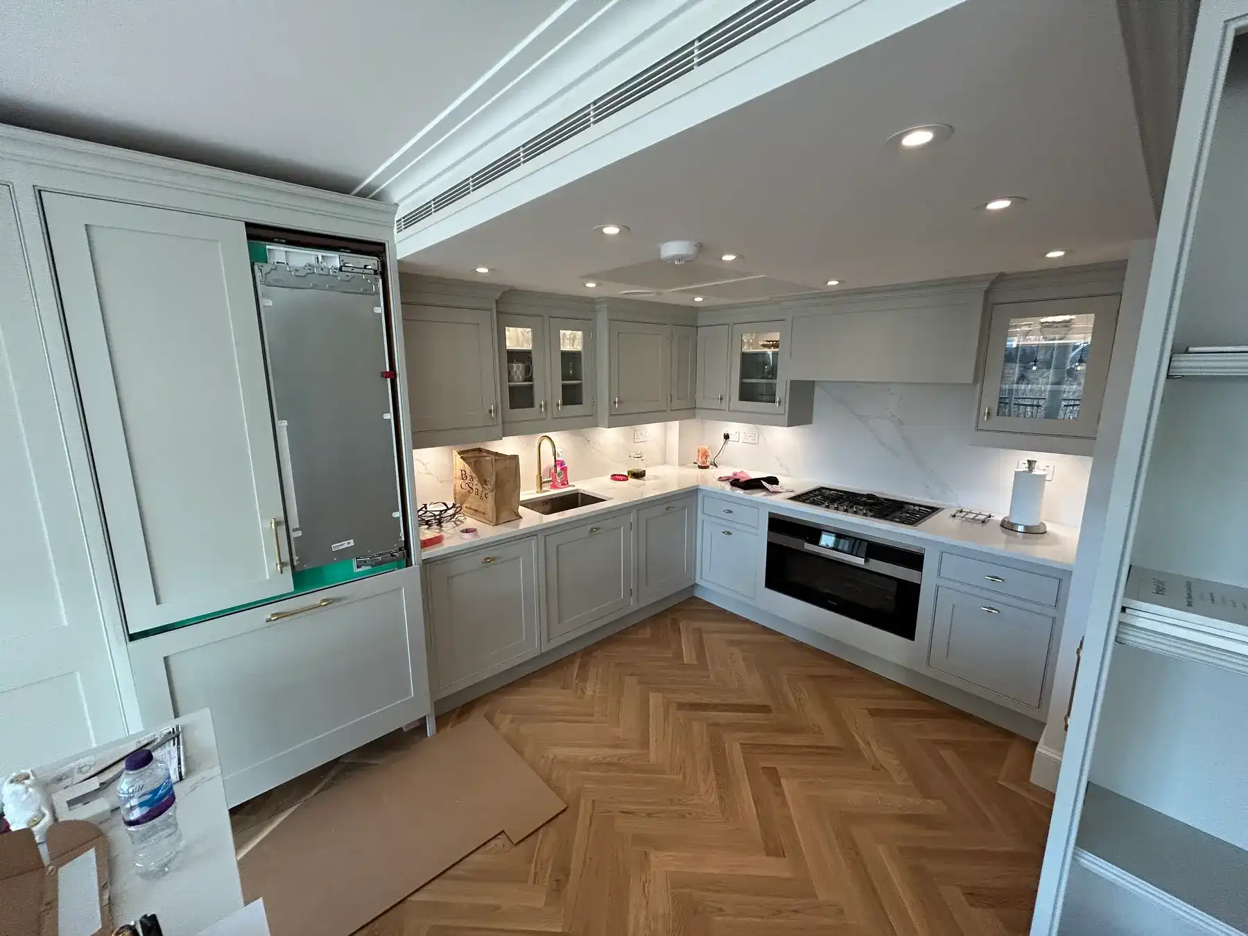 Shaker kitchen with gold tap and marble splashback - London apartment refurbishment Kings Road