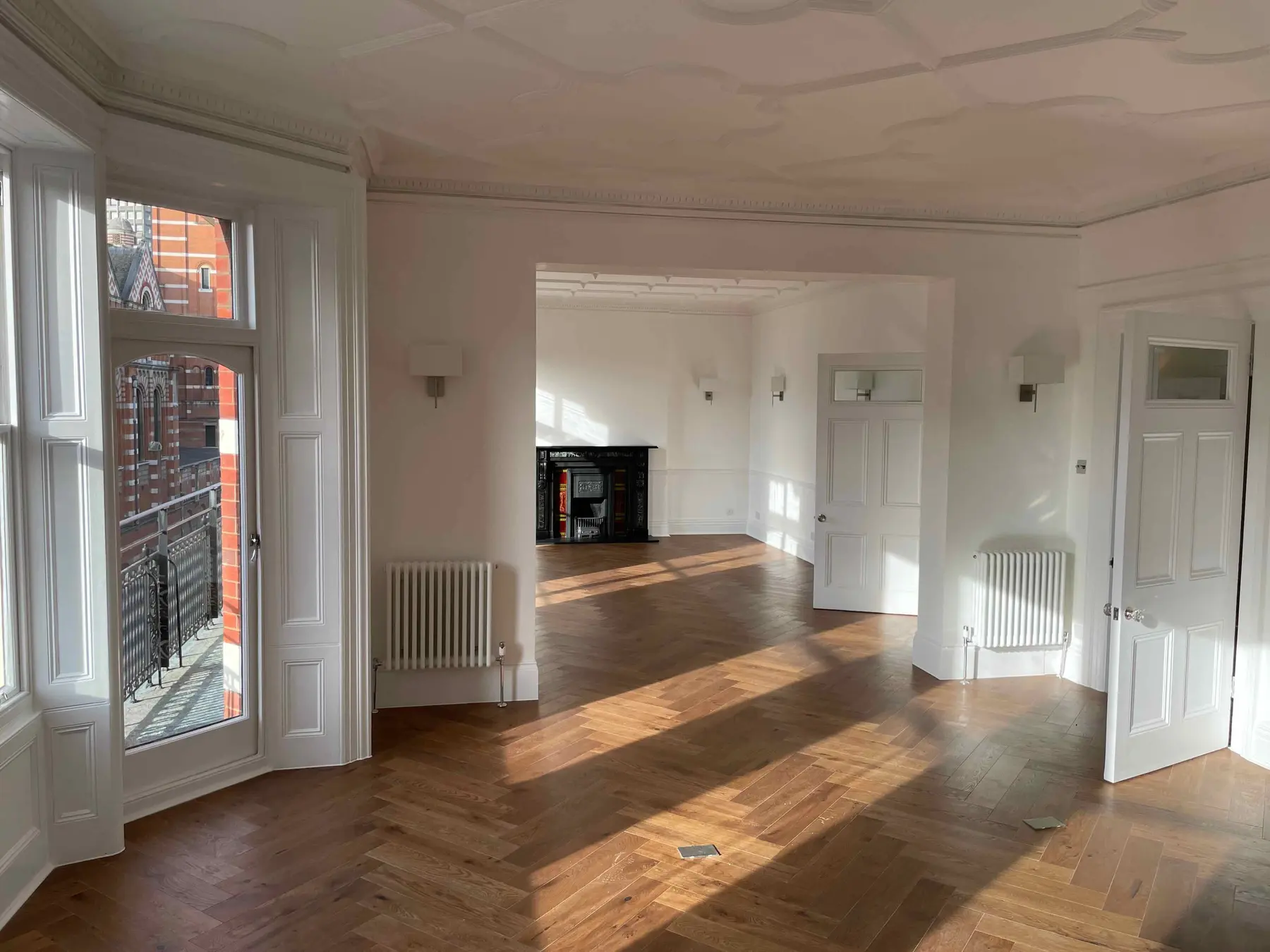 Completed lounge with herringbone flooring and period detailing - Westminster SW1P